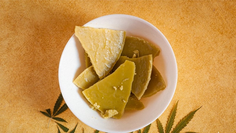 Multiple pieces of cannabutter on a white bowl