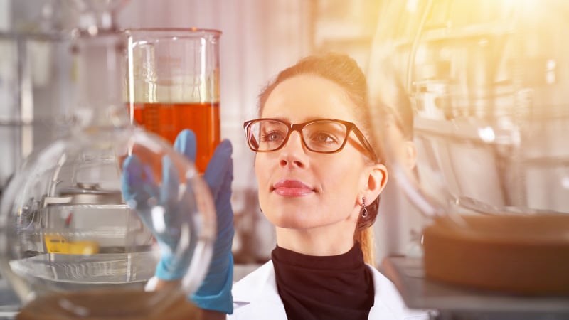A woman scientist studying the effects of CBD oil in a lab