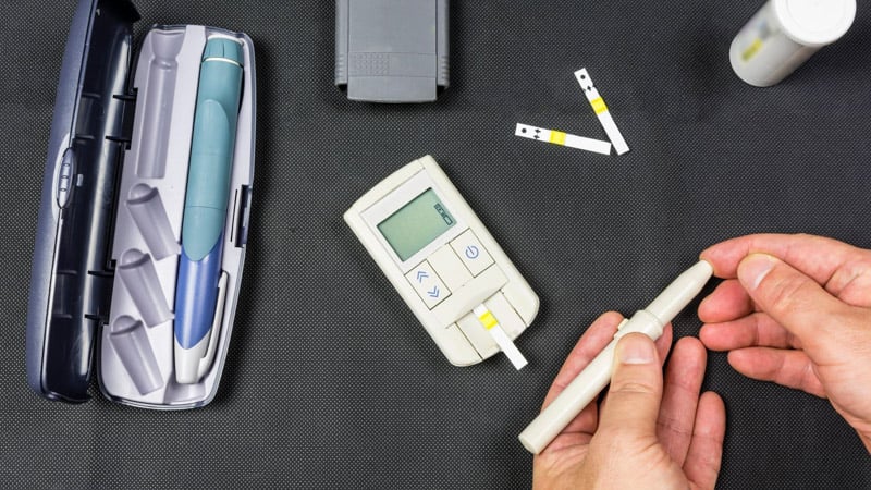 a person is testing blood sugar level for diabetes type 2