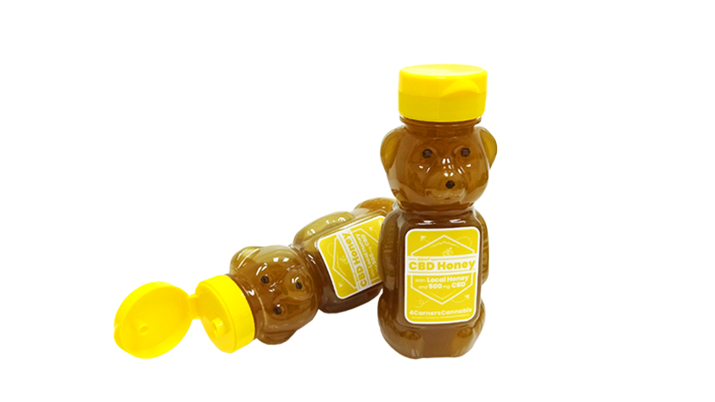 4 corners cbd honey edible on white background