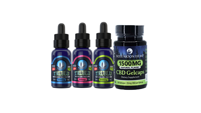 blue moon hemps cbd oils and capsule on white background