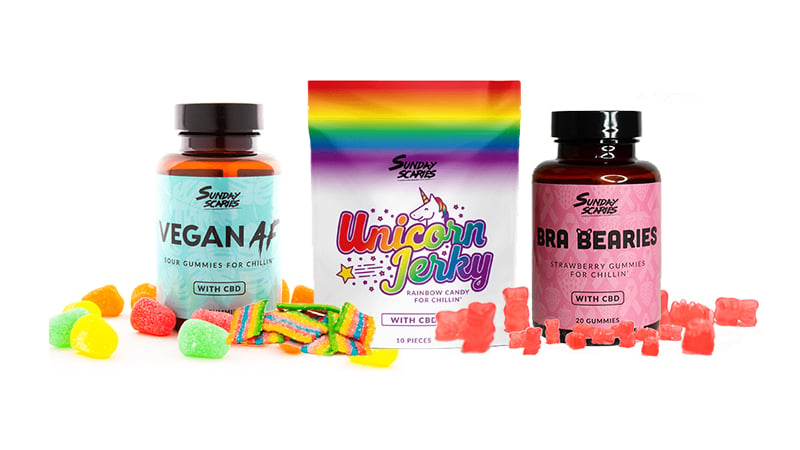 Sunday Scaries regular and vegan gummies with unicorn jerky edibles on white background