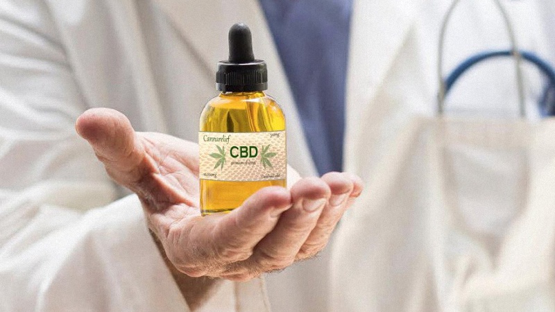 Doctor Showing CBD Oil In His Palm 