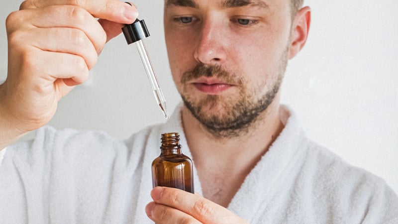 A man using CBD Oil