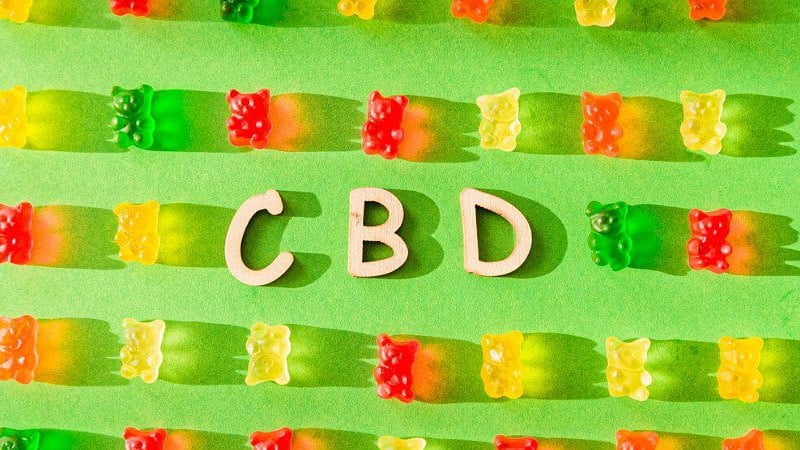 CBD Gummies in Green Background