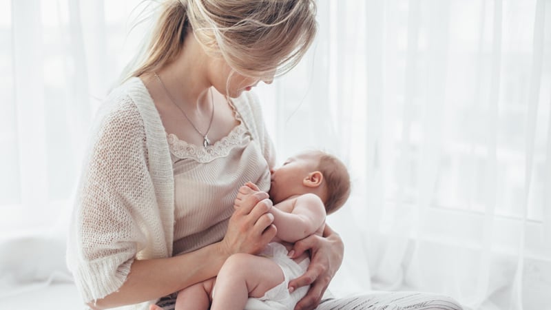 mom is holding her baby