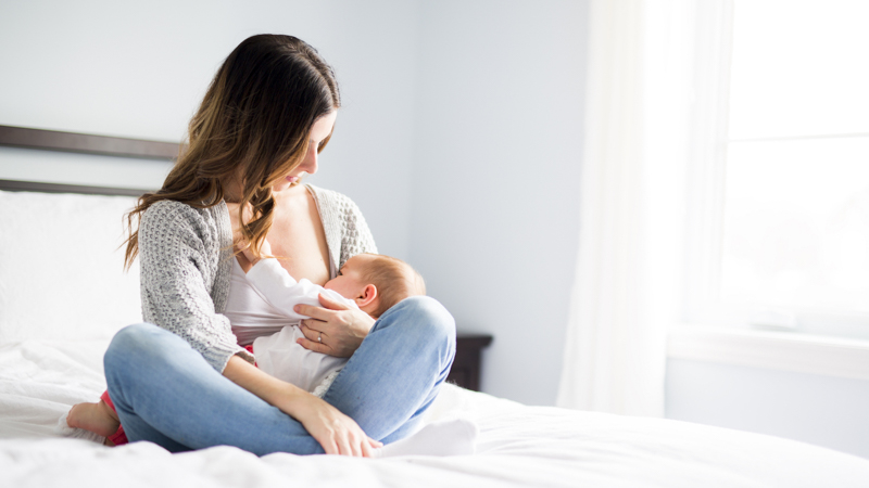 mom is breastfeeding her baby