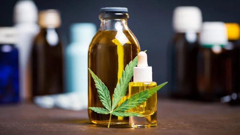 CBD Oil in Big and Small Bottle with Hemp Leaf 