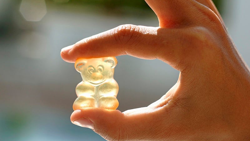 Hand holding a gummy bear